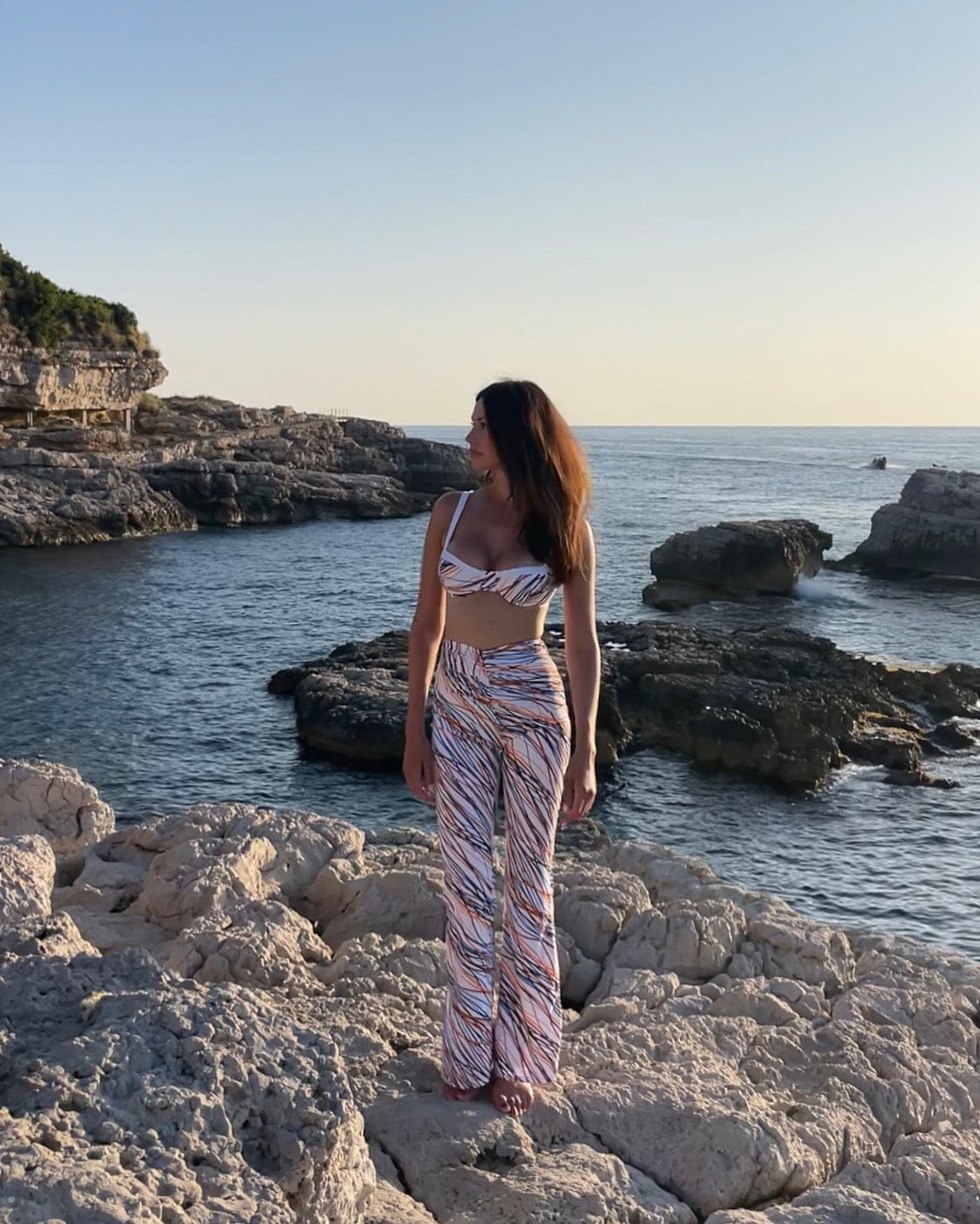 Multicoloured fantasy luxury beachwear long trousers for women made in Italy with draped detail in recycled lycra econyl
