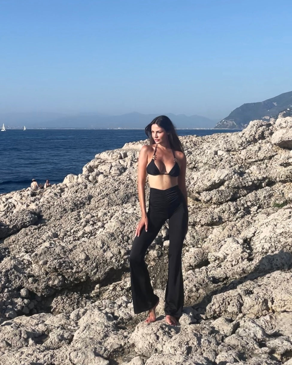 Black luxury beachwear long trousers for women made in Italy with draped detail in recycled lycra econyl